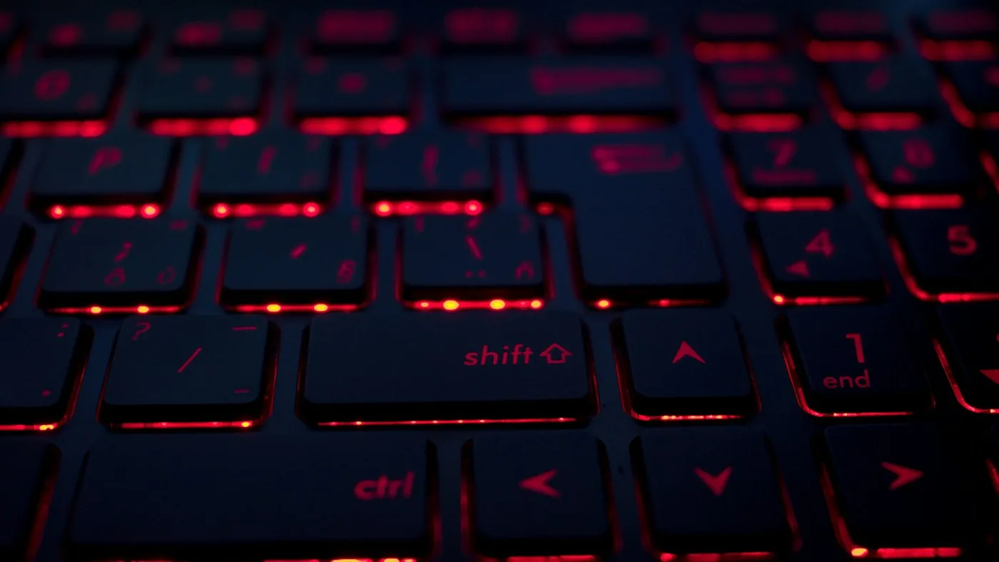 Red backlighting illuminating the keys of a computer keyboard